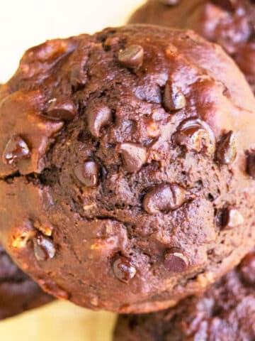 Overhead Shot of Stack of Double Chocolate Muffins With Chocolate Chips and Bananas.