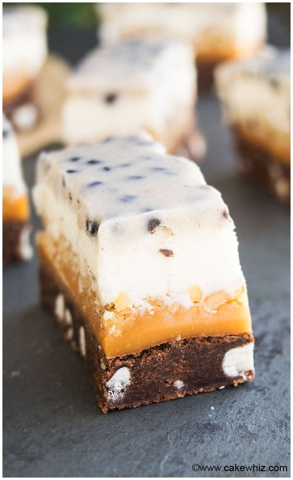 Slices of Cookie Bars on Black Stone Background. 