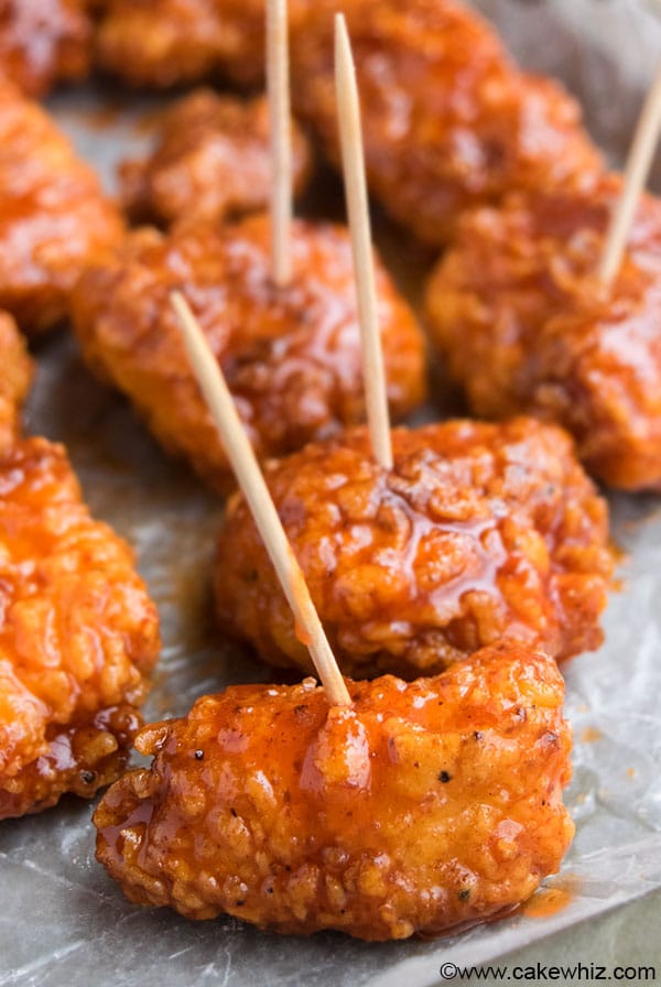 Honey Sriracha Chicken Bites on Sheet of Wax Paper. 