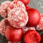 Easy Red Velvet Truffles With Cake Mix Stacked on Rustic Gray Background