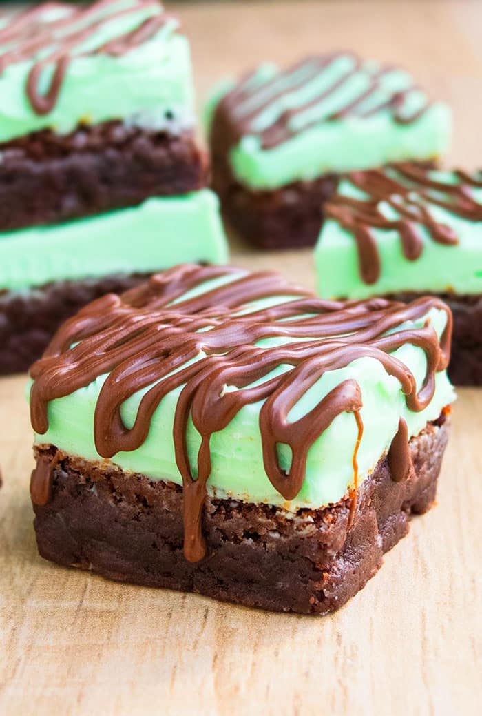 Slice of Chocolate Mint Brownies on Wood Background. 