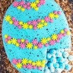 Easy Pinata Cake (Easter Robin Egg Cake) With One Slice Removed on Rustic Background