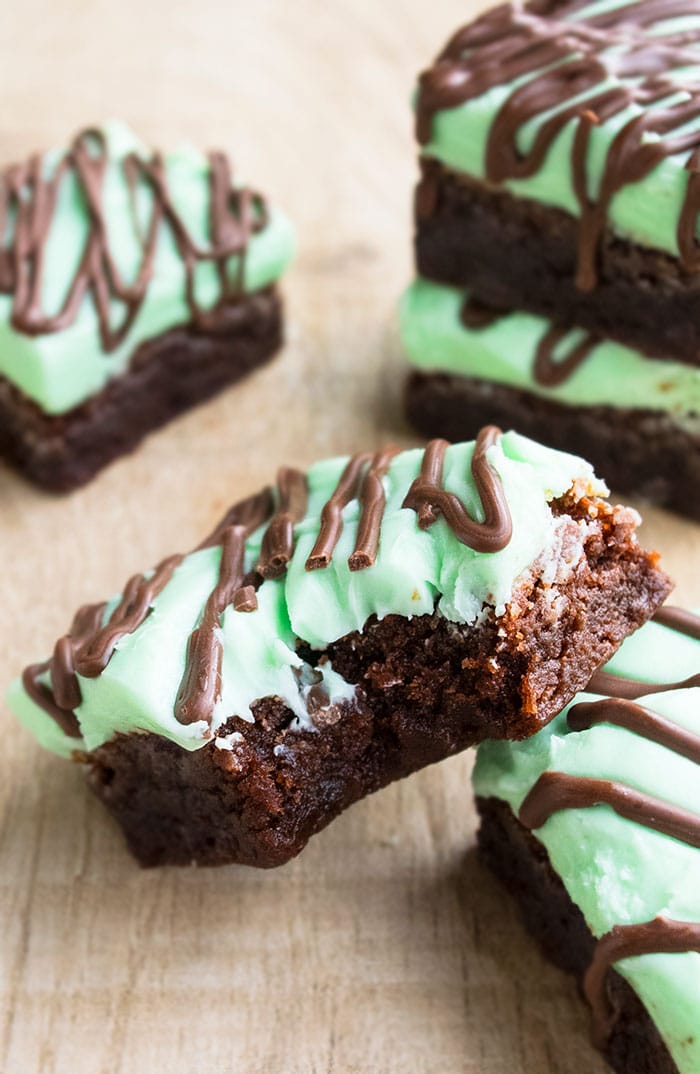 Partially Eaten Chocolate Mint Brownie on Wood Background. 