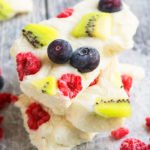 Stack of Easy Frozen Yogurt Bark With Fresh Fruits on Rustic Gray Background.