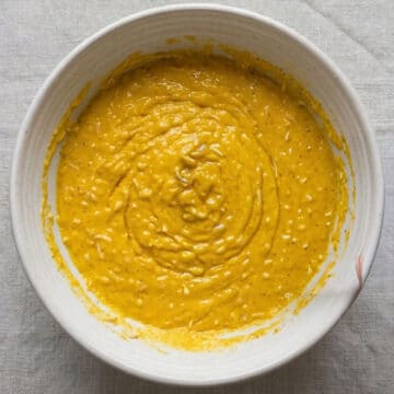 Dry and wet mixture combined together in bowl. 