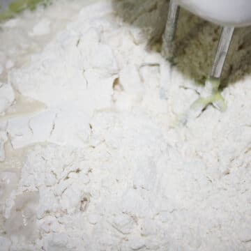 Dry mixture added to wet mixture. 