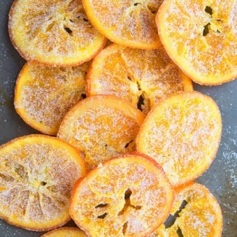 Easy Candied Orange Slices and Peels on Gray Tray.