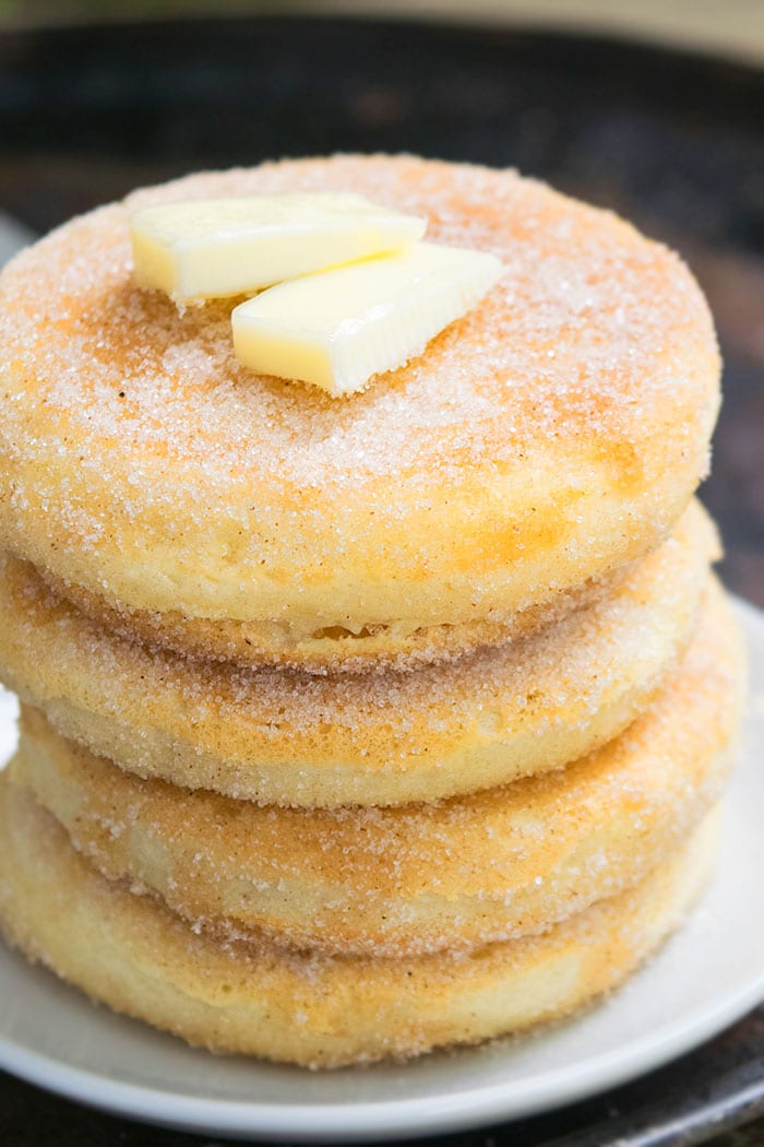 Stack of Easy Cinnamon Pancakes With Slices of Butter on Top.