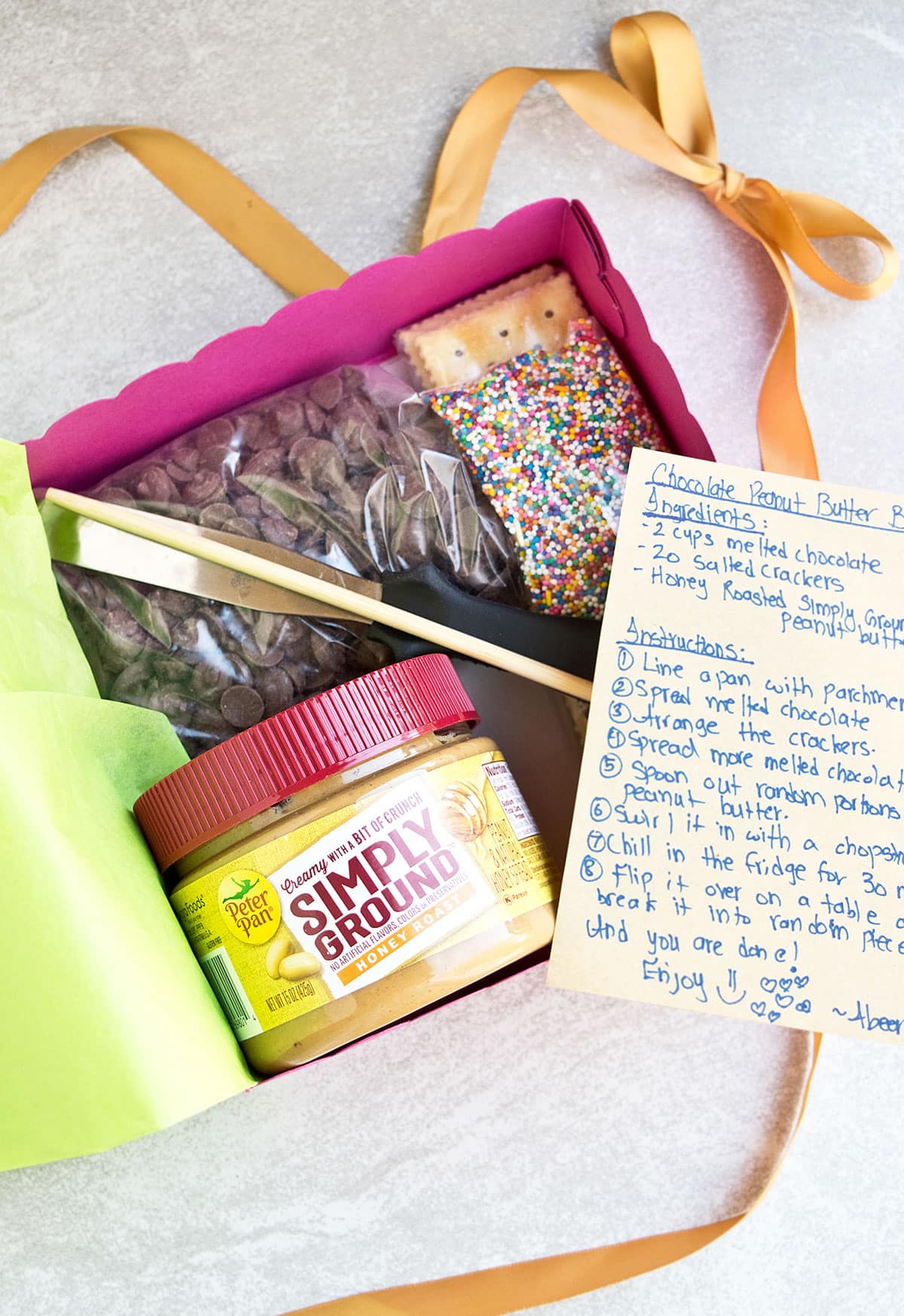 DIY homemade candy gift box on light gray background. 