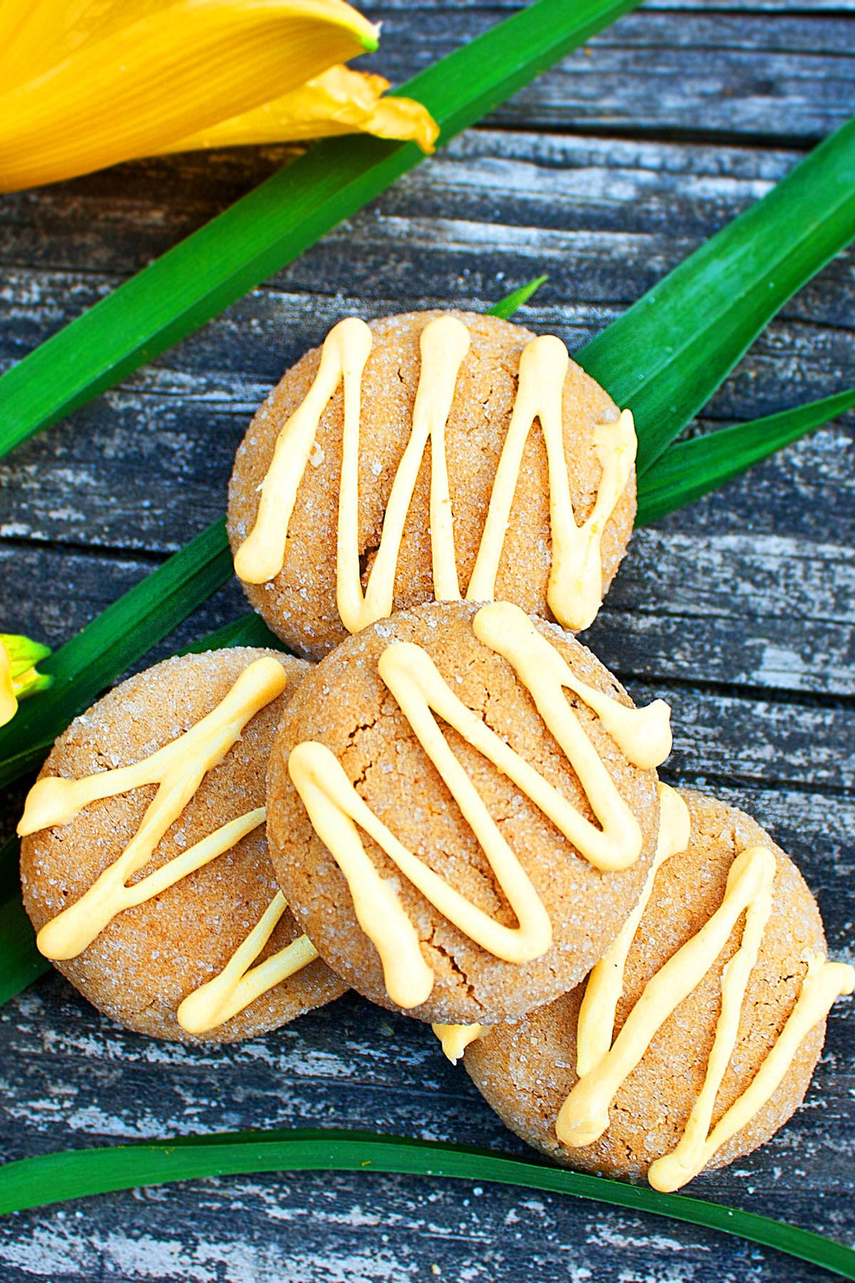 Spiced Swedish Cookies With Yellow Chocolate Drizzle on Rustic Wood Background.  