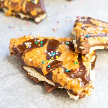 Closeup Shot of Easy Peanut Butter Chocolate Bark Candy on Light Gray Background.