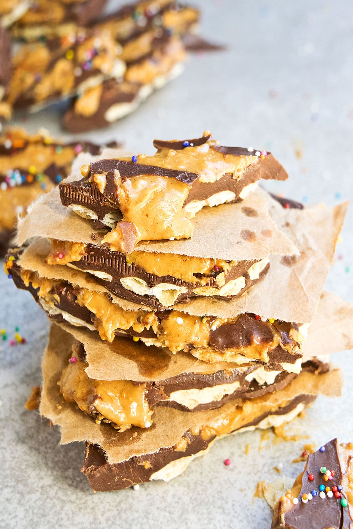 Stack of Bark Candy Pieces on Light Gray Background. 