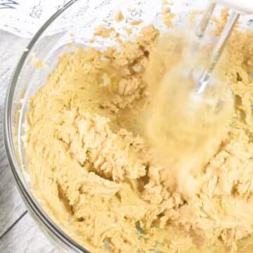 Wet ingredients being mixed together in glass bowl. 