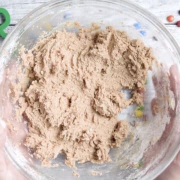 Sticky cookie dough in glass bowl. 