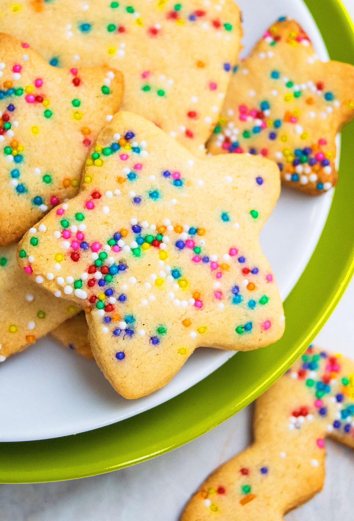 Easy Cut Out Funfetti Cookies on White and Green Dish. 