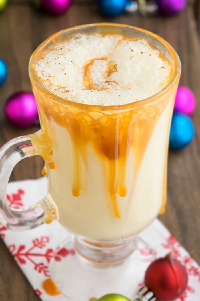 Christmas Holiday Nog with Caramel Sauce in Glass Mug. 