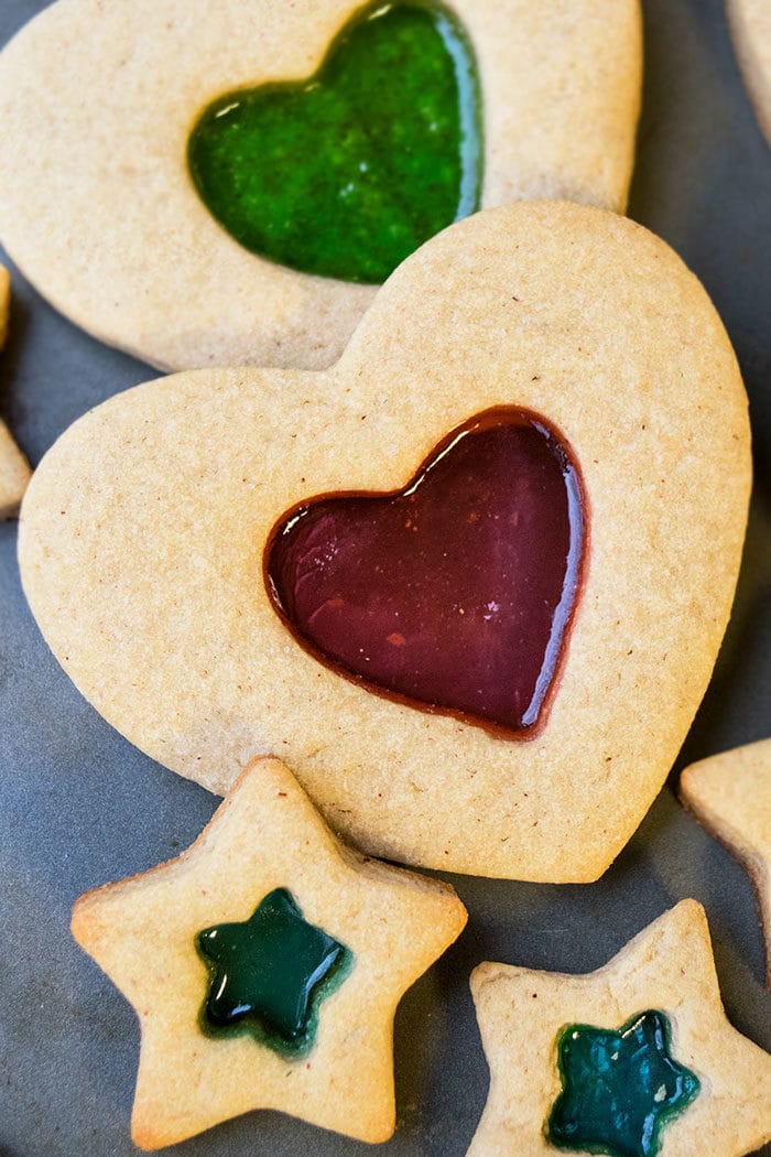 Classic Stained Glass Window Biscuits on Gray Baking Tray With Focus on Heart Shaped Cookie