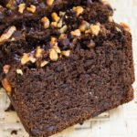 Slices of Easy Chocolate Banana Bread With Cake Mix on Straw Tray.