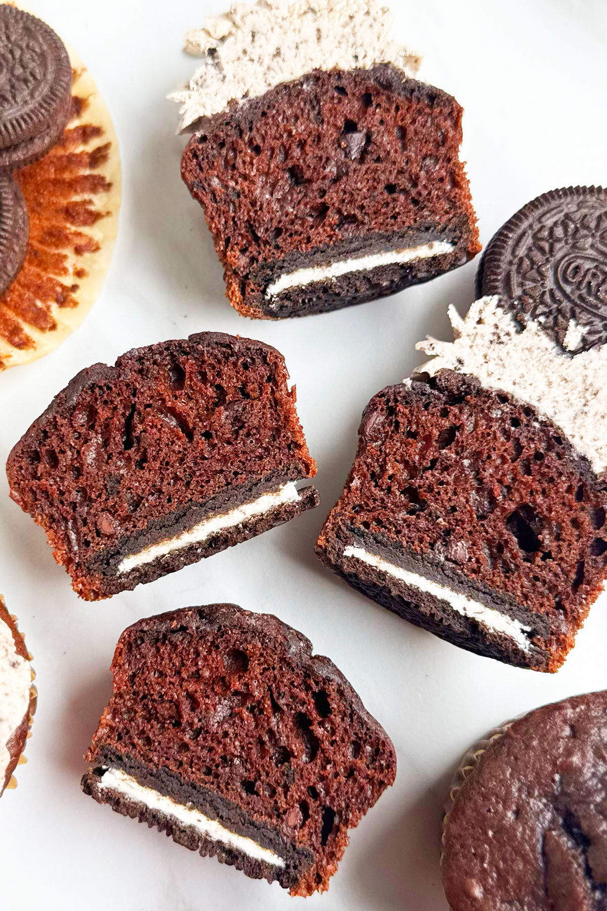 Cupcakes cut in half to show the cookie bottom. 