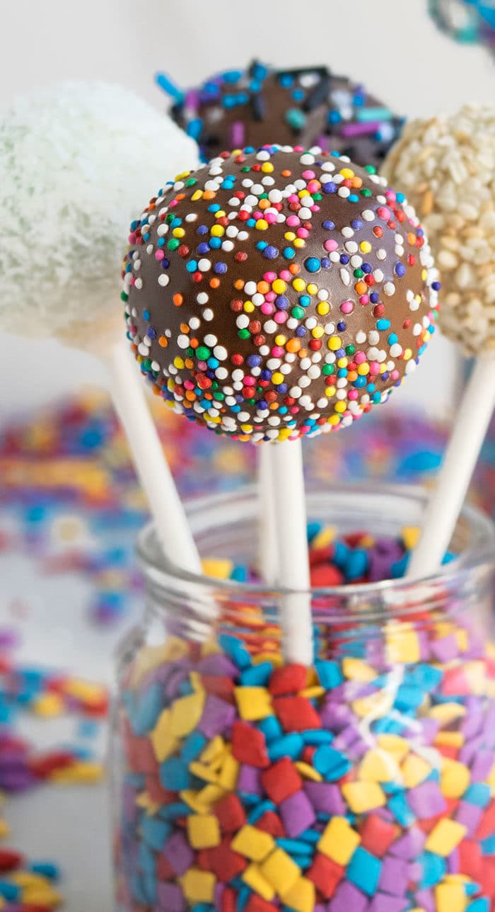 Easy Homemade Cake Pops in Glass Jar of Sprinkles. 
