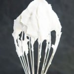 Easy Stabilized Homemade Whipped Cream on Spatula With Gray Background