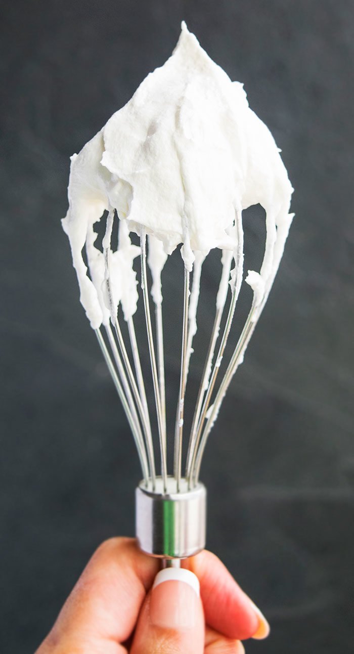 Easy Homemade Whipped Cream on Spatula With Gray Background