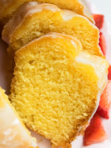 Easy Homemade Lemon Bundt Cake With Cake Mix on White Dish.