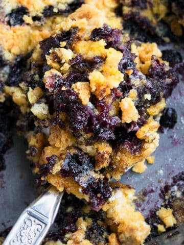 Spoonful of Blueberry Dump Cake (Blueberry Cobbler Dump Cake) in Gray Pan