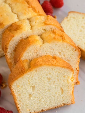 Slices of Buttermilk Pound Cake on White Marble Background.