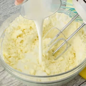 Milk being poured in the mixture. 