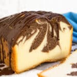Best Moist Marble Cake With Chocolate Swirl Design and Chocolate Ganache Topping on White Dish.