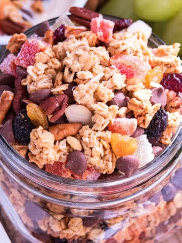 Easy homemade crunchy granola in glass jar- Closeup shot.