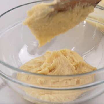 Portion of vanilla cake batter removed to a separate glass bowl.