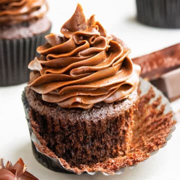 Best Easy Soft and Moist Chocolate Cupcakes With Chocolate Buttercream Frosting- Liner Partially Removed.