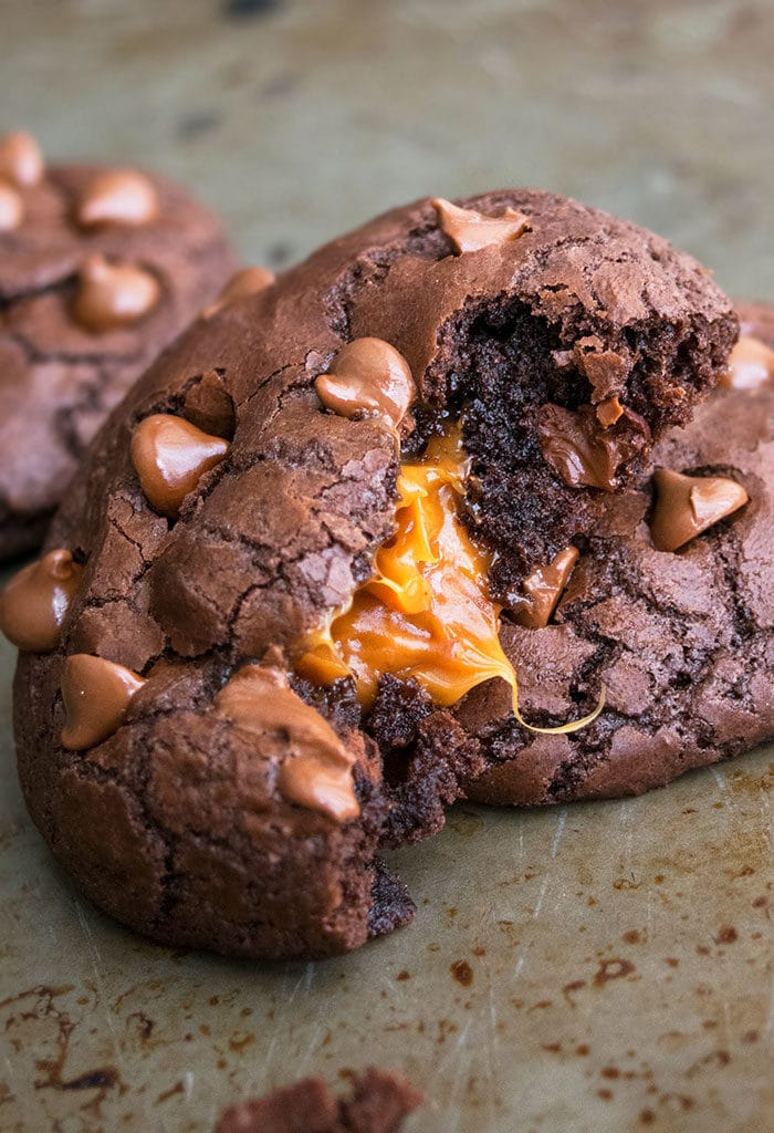 Partially Eaten Chocolate Caramel Cookies With Caramel Filling Oozing out From the Center 