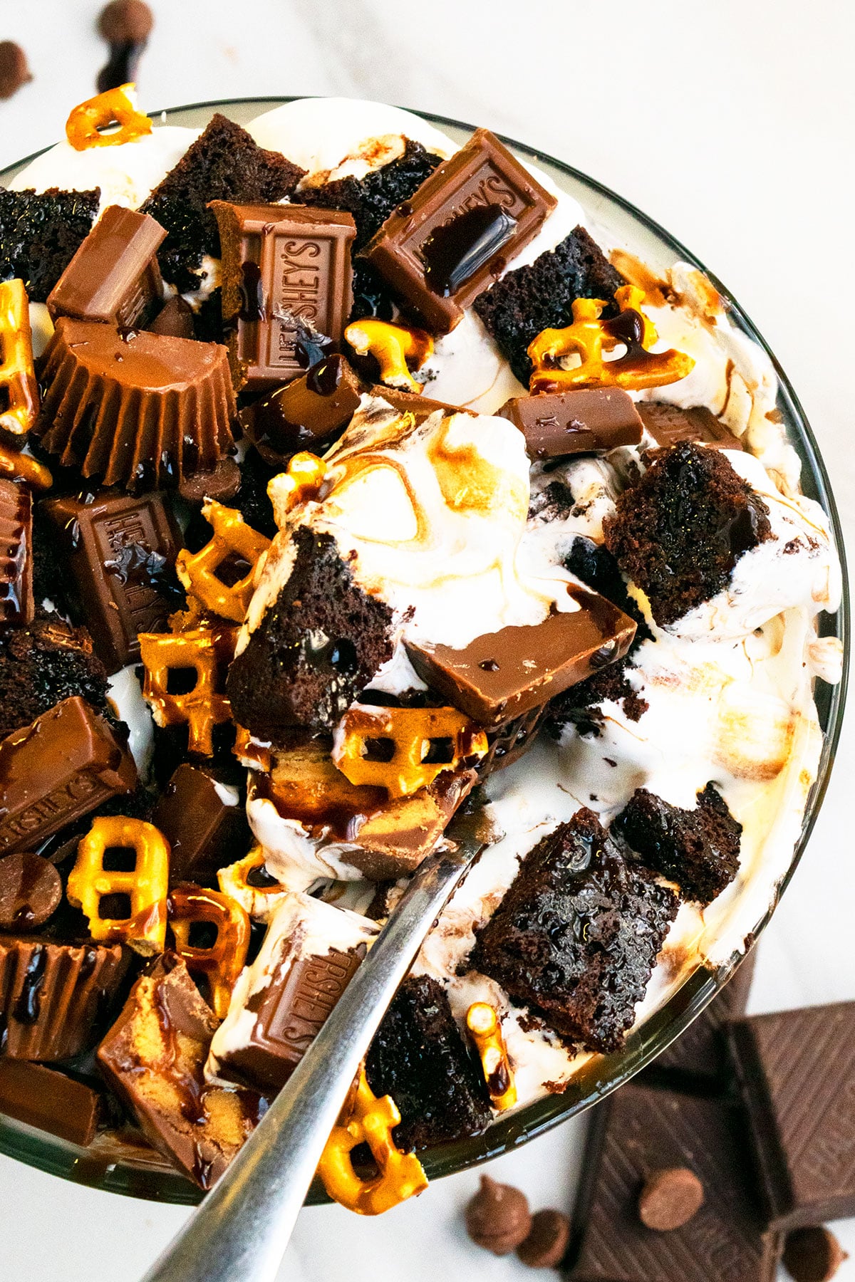 Closeup Shot of Pound Cake, Pretzels, Chocolate Sauce and Whipped Cream. 