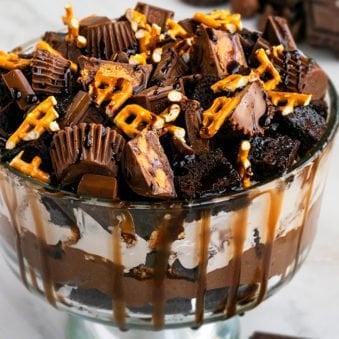 Easy Chocolate Trifle in Large Glass Bowl on White Marble Background.