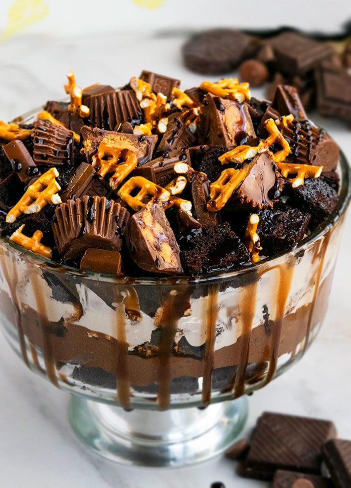 Easy Chocolate Trifle in Large Glass Bowl on White Marble Background.