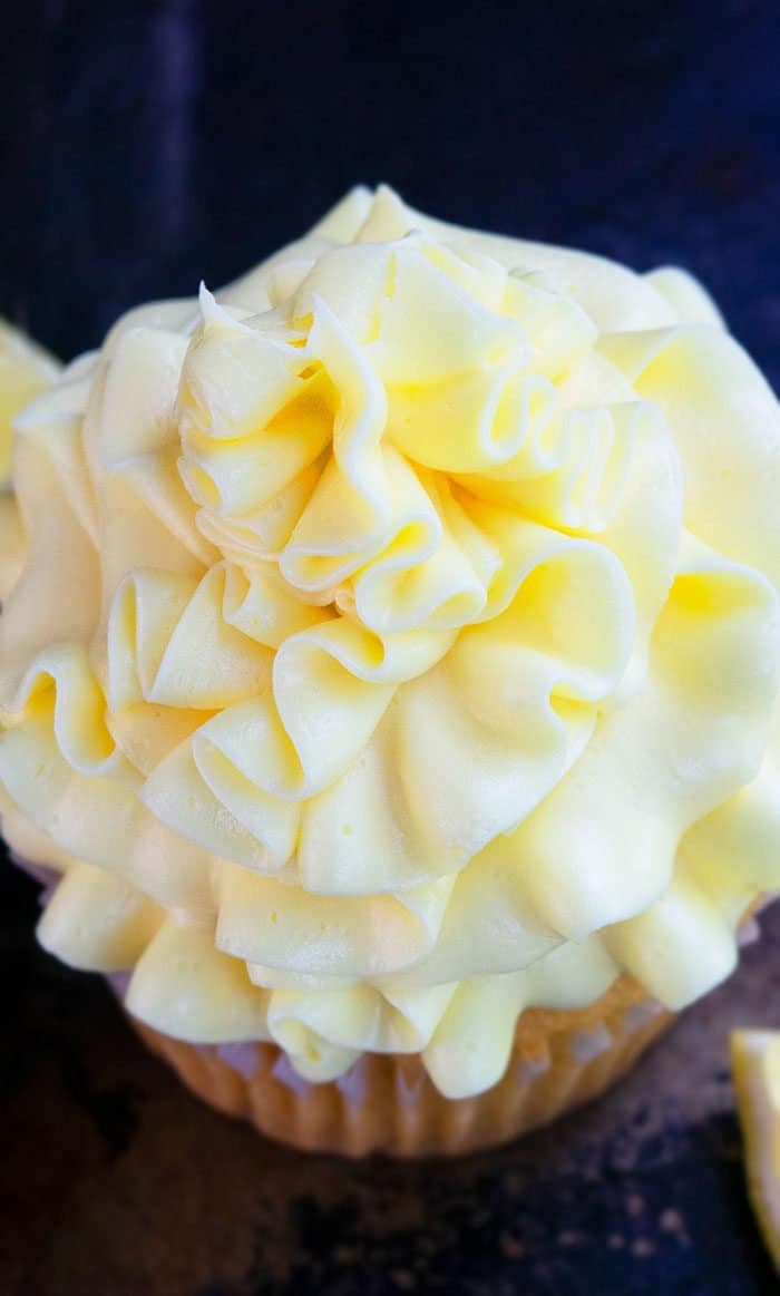 Lemon Buttercream Icing Swirl on Top of Cupcake- Closeup Shot