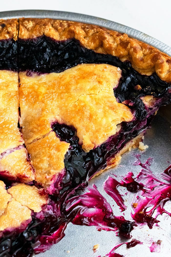 Closeup Shot of a Slice of Blueberry Pie in Steel Pan. 