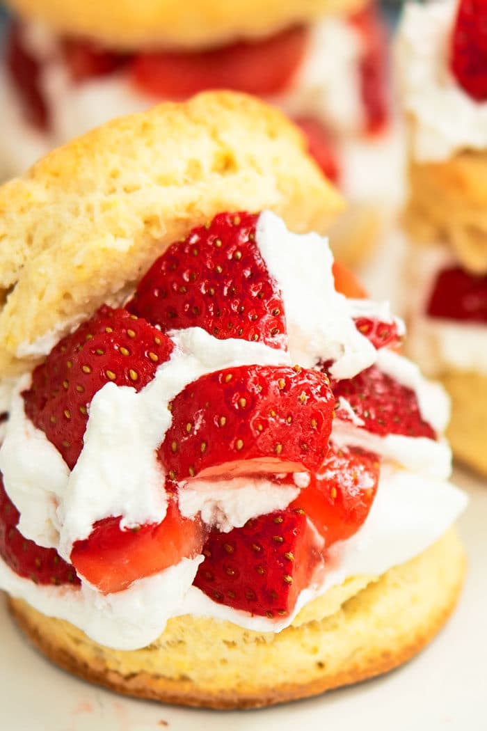 Biscuits Filled With Macerated Strawberries and Whipped Cream on White Dish
