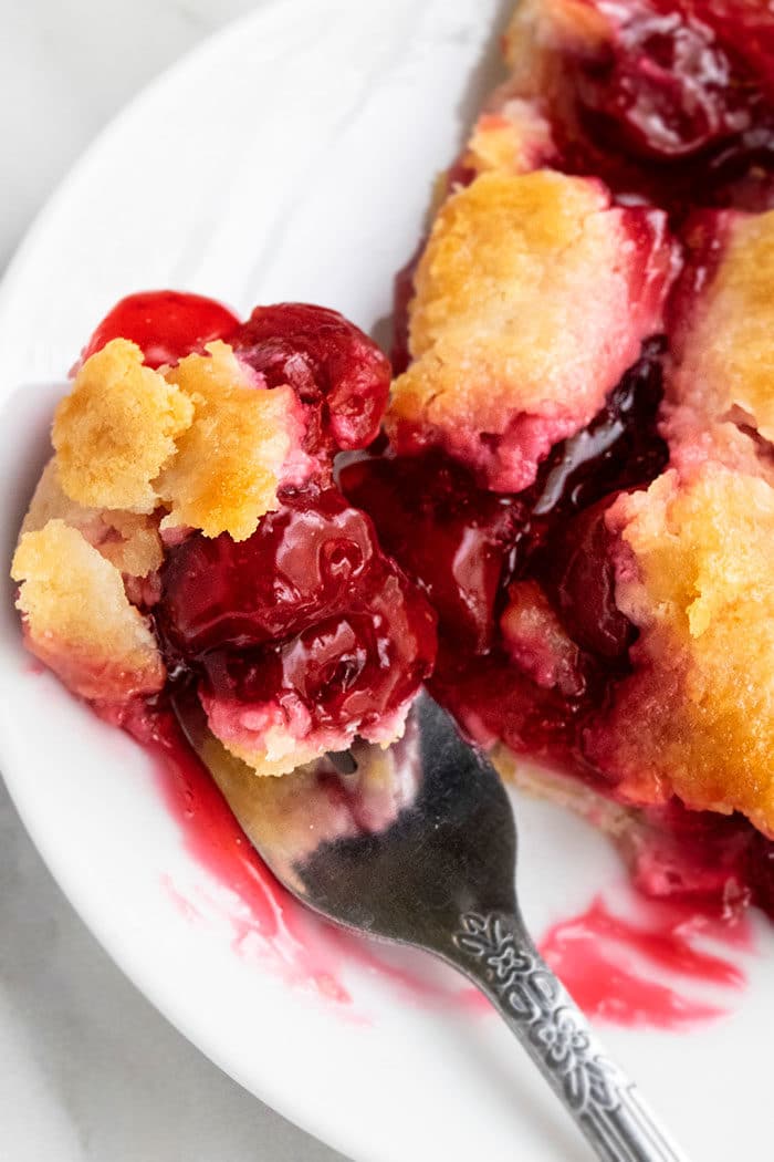 Spoonful of Berry Pie in White Dish