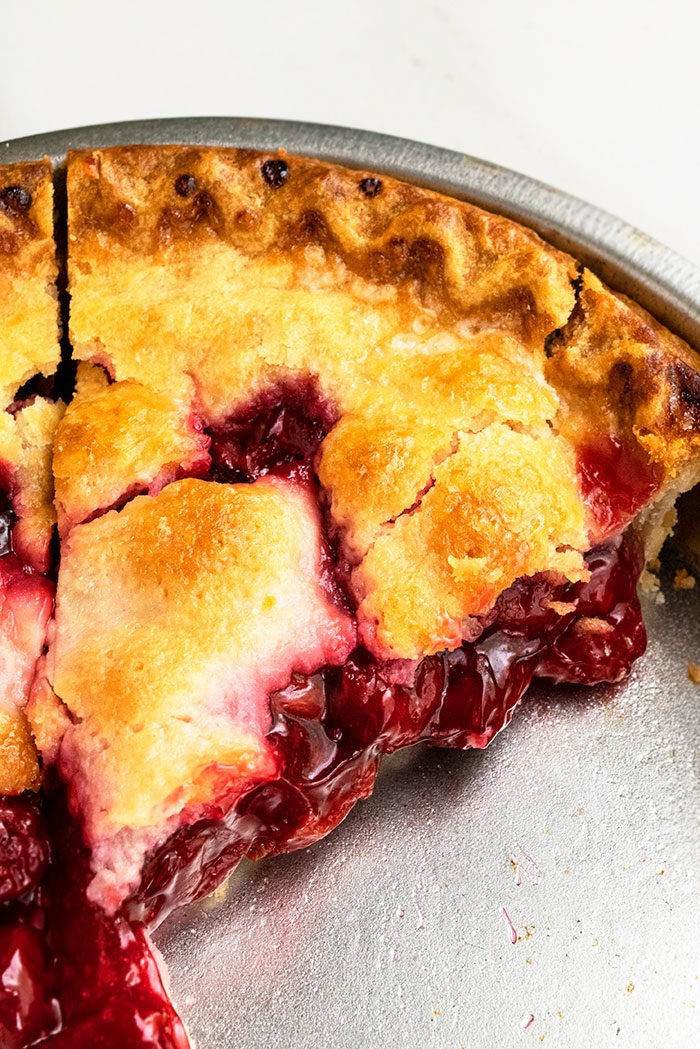 Easy Homemade Cherry Pie Sliced in Aluminum Pie Dish