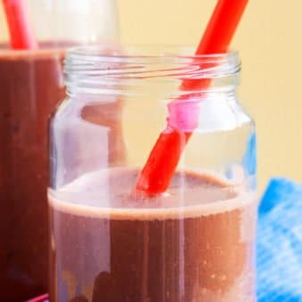 Chocolate Banana Smoothie in Mason Jar With Red Straw.