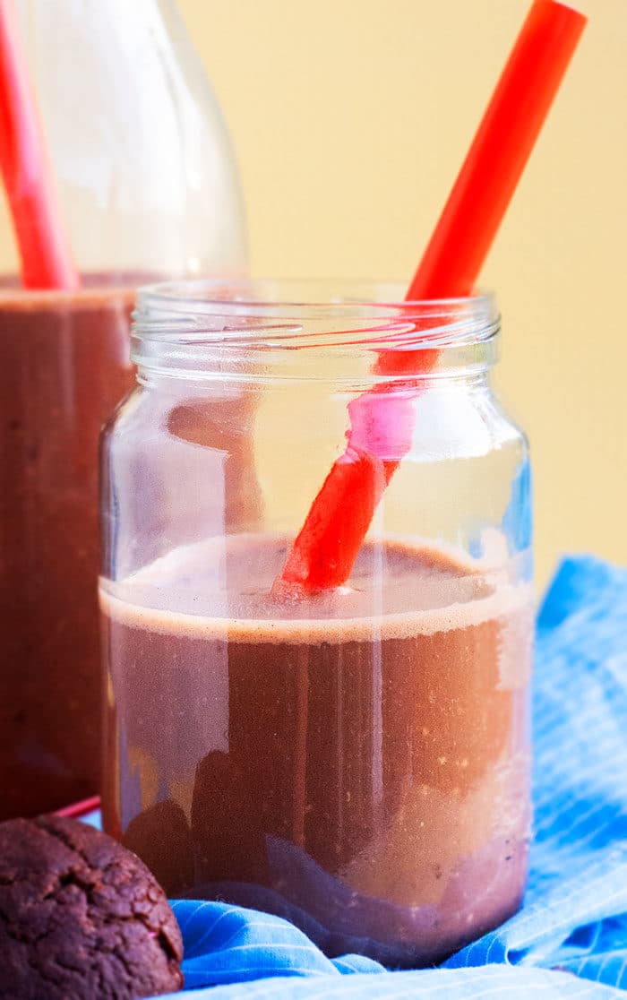 Chocolate Banana Smoothie in Mason Jar With Red Straw. 