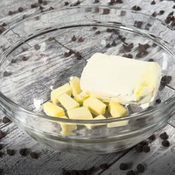 Cream cheese and butter in glass bowl. 