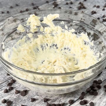 Creamed butter and cream cheese in glass bowl. 