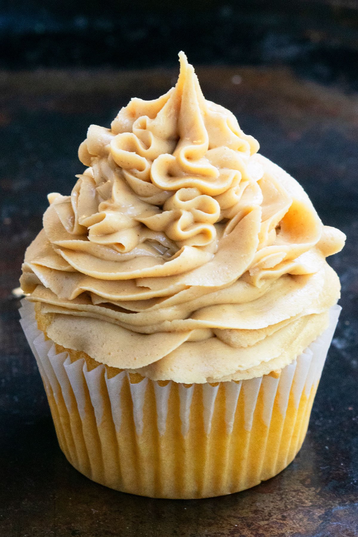 Easy Peanut Butter Frosting Piped on Top of Cupcake.