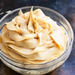 Glass bowl of easy homemade peanut butter frosting with 4 ingredients.