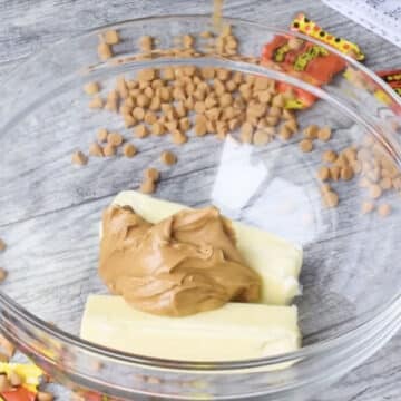 Butter and peanut butter in large glass bowl. 